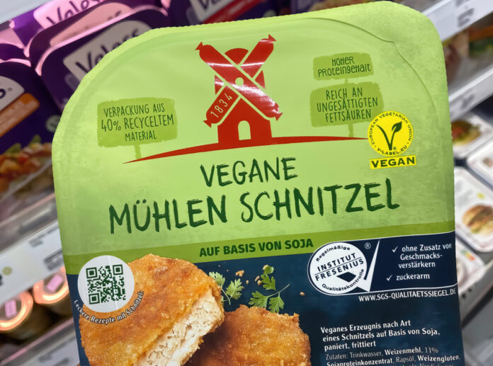 Viersen, Germany - January 9. 2022: Closeup of packet with vegan meatless schnitzel on soy base in german supermarket